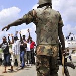 nigerian soldier abusing civilians